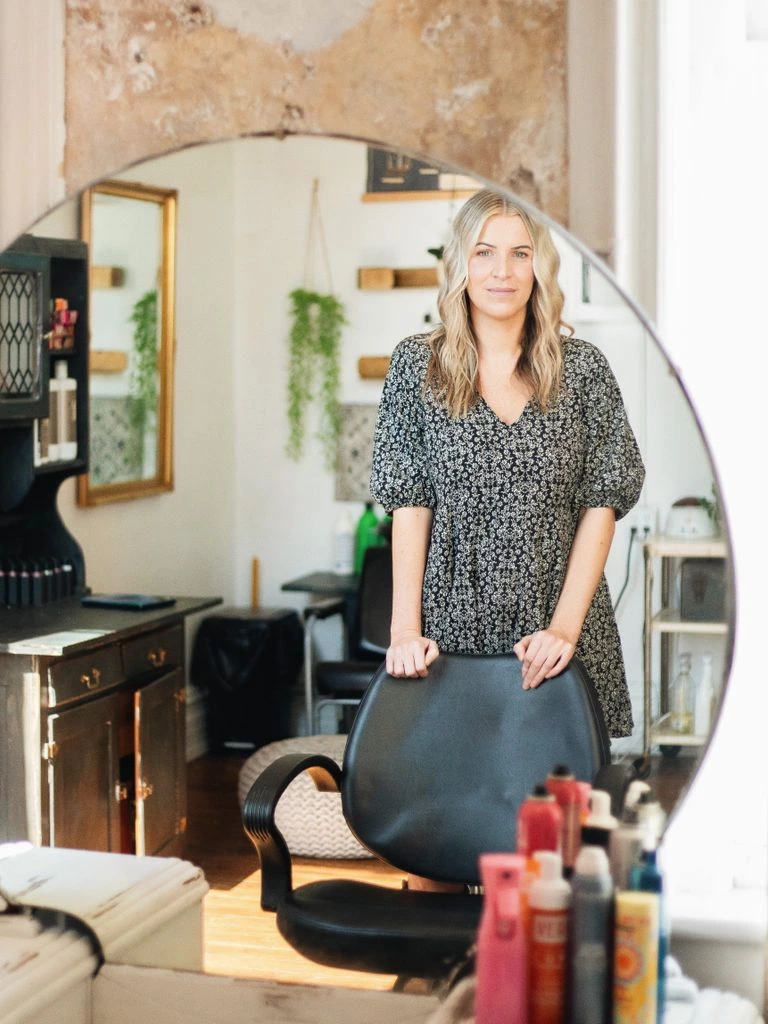 A Roanoke Valley business owner at the counter of their workshop, ready to be discovered by local partners.